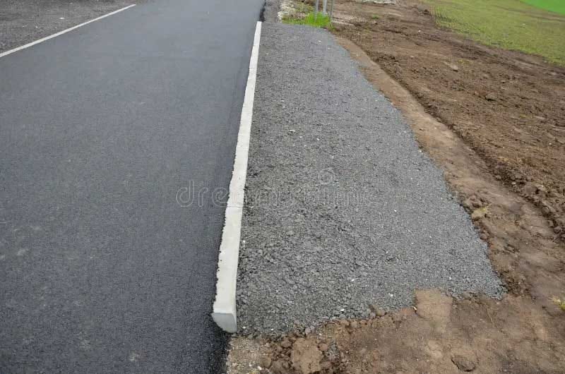 Recycled bitumen driveway - recycled asphalt crumb used edge new cycle path subsoil asphalt road field